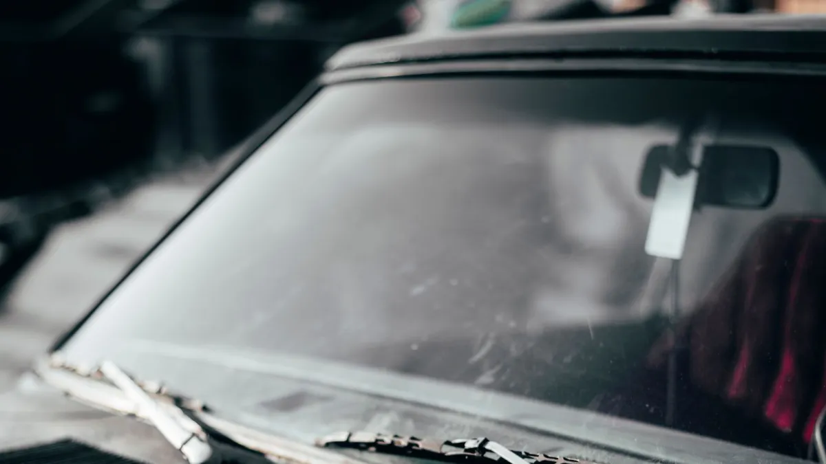 The windscreen and cowl of an older car, where a VIN plate is usually fixed